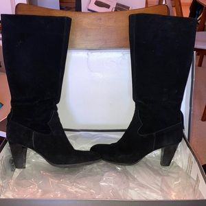 Black boot, size 10, knee-high. Used but in good condition.